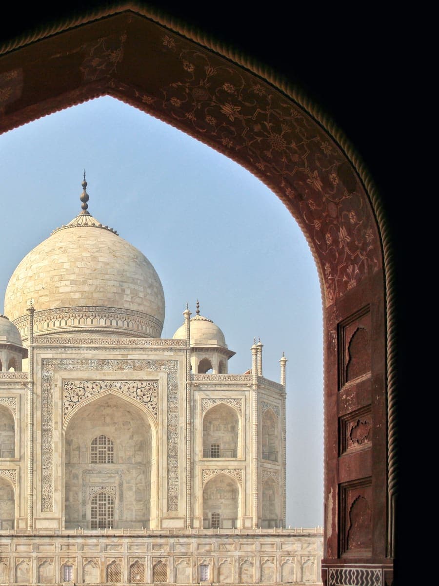 The Taj Mahal framed by an arched gateway