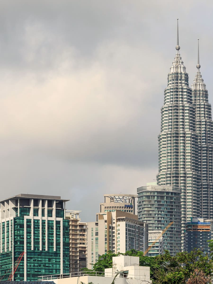 The Petronas Twin Towers above the Kuala Lumpur skyline