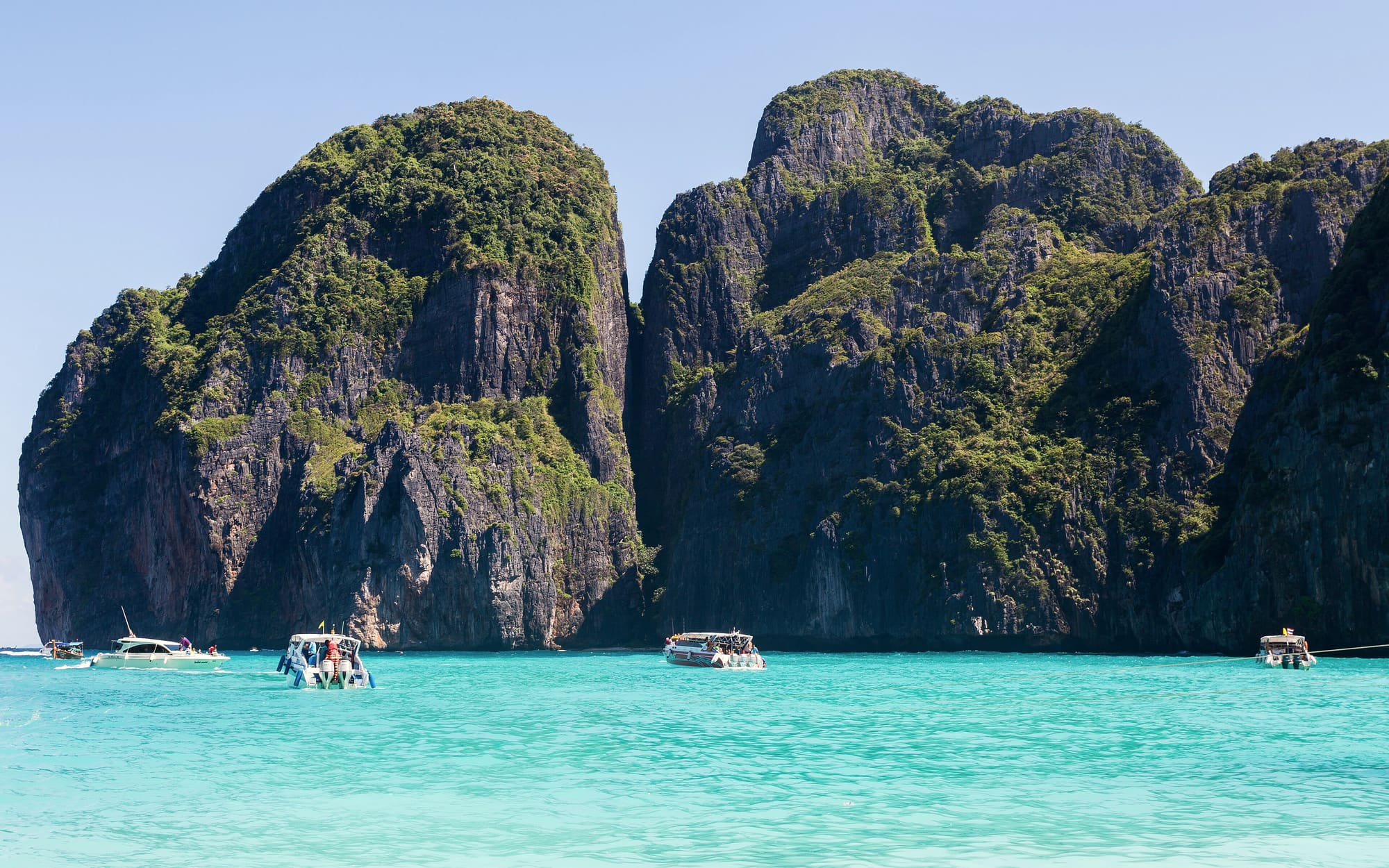 Turquoise water below the limestone cliffs of Phi Phi